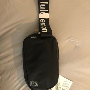 Lululemon everywhere belt bag in black and white.
